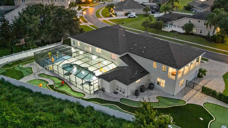 Luxury Formosa Gardens vacation rental in Orlando with private screened pool, mini golf, and spacious outdoor entertainment area near Disney