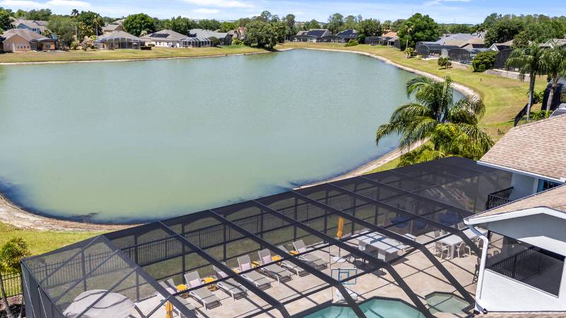 Luxury Formosa Gardens vacation rental in Orlando with screened pool area overlooking a large private lake.