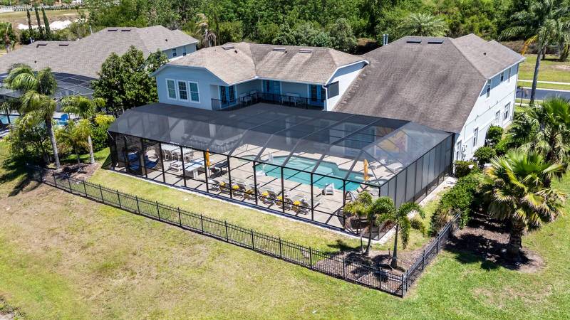Formosa Gardens Orlando vacation home featuring oversized screened pool, private backyard, and outdoor seating area near Disney